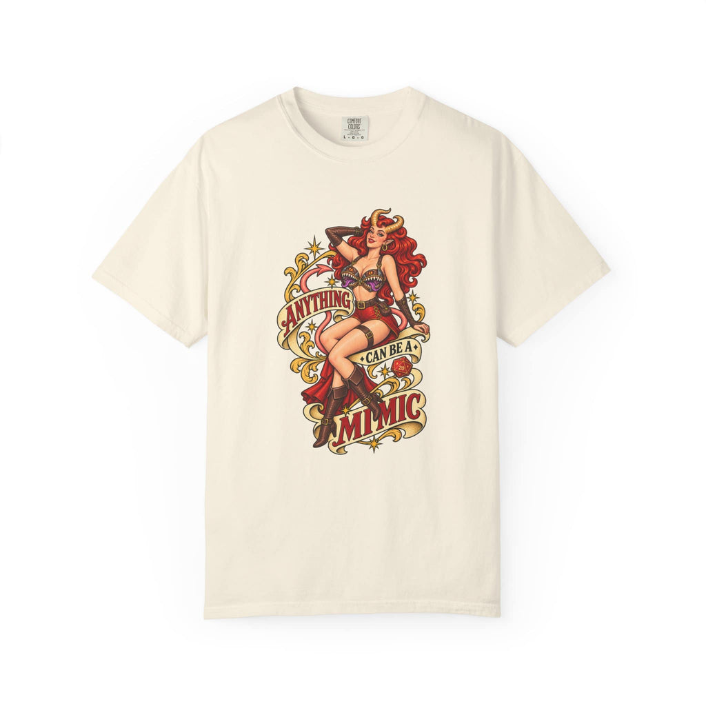 Off-white ivory graphic t-shirt laid flat displaying vintage fantasy campaign artwork of a horned pinup girl and D20 dice.