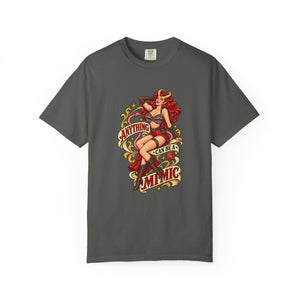 A dark gray crewneck t-shirt featuring a vintage-style pin-up graphic of a woman with red hair and the text 'ANYTHING CAN BE A MIMIC' in red and gold.