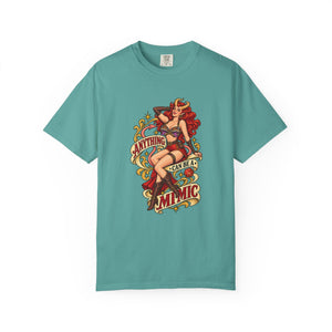 Seafoam teal green Comfort Colors t-shirt laid flat, featuring a detailed tabletop RPG fantasy illustration with golden scroll banners
