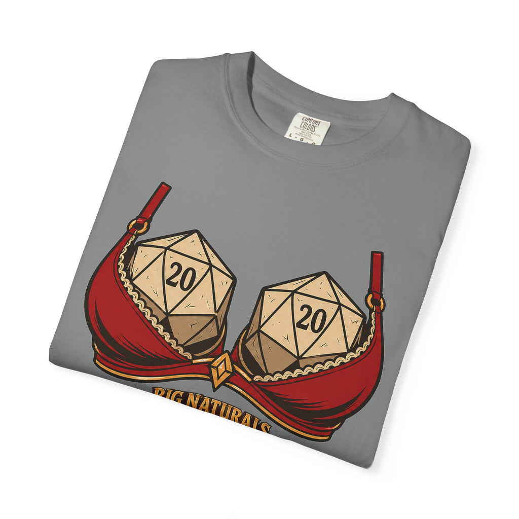 Neatly folded medium grey Comfort Colors t-shirt showcasing the funny "Big Naturals" D20 tabletop gaming graphic on a seamless white background.