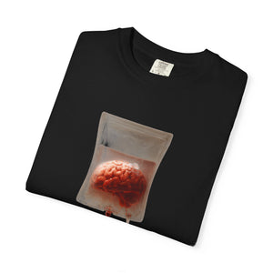 A folded black t-shirt with a centered graphic of a brain suspended in an IV drip bag