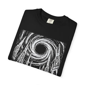 Folded black t-shirt close-up highlighting the intricate black and white black hole astronaut design with ancient ruins and swirling vortex.