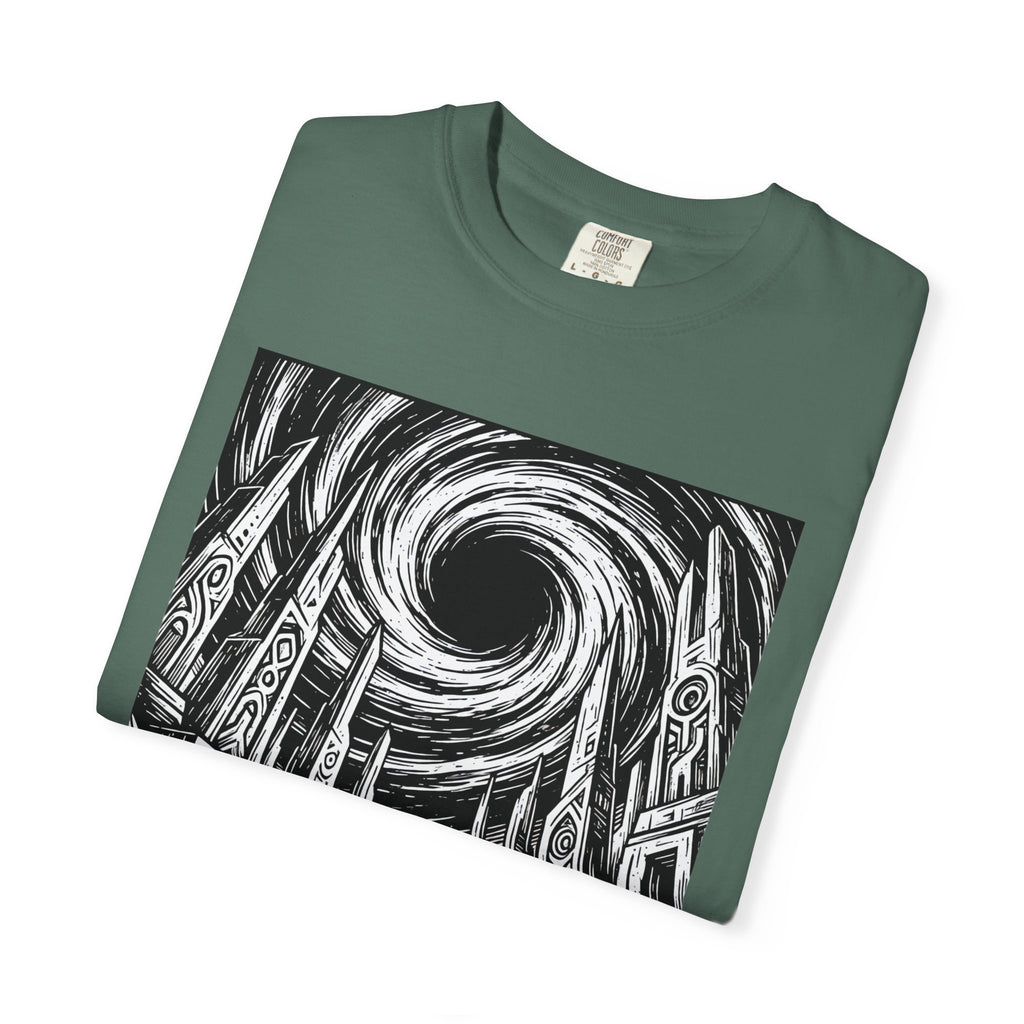 Folded forest green t-shirt displaying a dramatic black and white woodcut print of an astronaut before a swirling black hole and alien ruins.