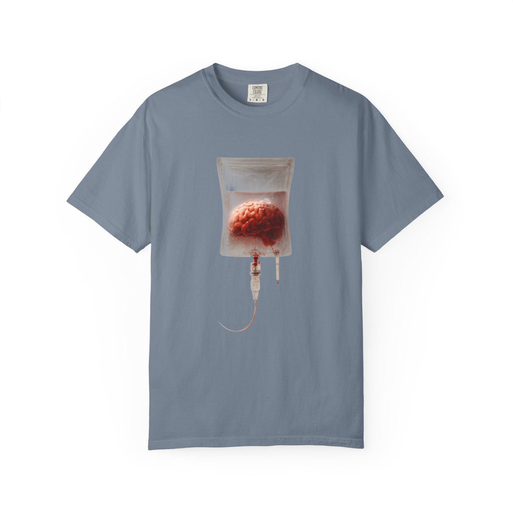 A blue-grey t-shirt displayed flat, featuring a surreal graphic of a brain suspended in an IV drip bag