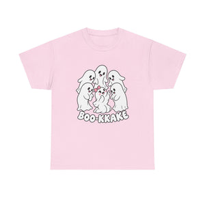 A light pink short-sleeve t-shirt with a cartoon graphic of five cute white ghosts huddled together with a pink bow, above the text 'BOO-KAKAKE' in white with a black outline.