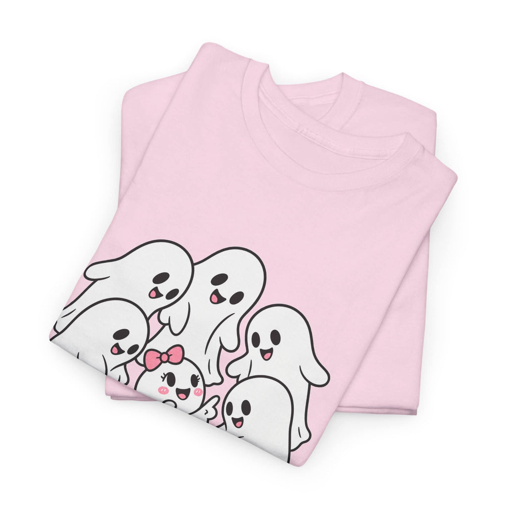 A folded light pink t-shirt featuring a cute cartoon graphic of five smiling ghosts in white with black outlines and pink accents, set against a plain white background.