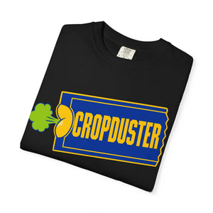 A neatly folded black garment-dyed tee showcasing a funny retro movie rental ticket stub graphic with a neon green cloud emblem.