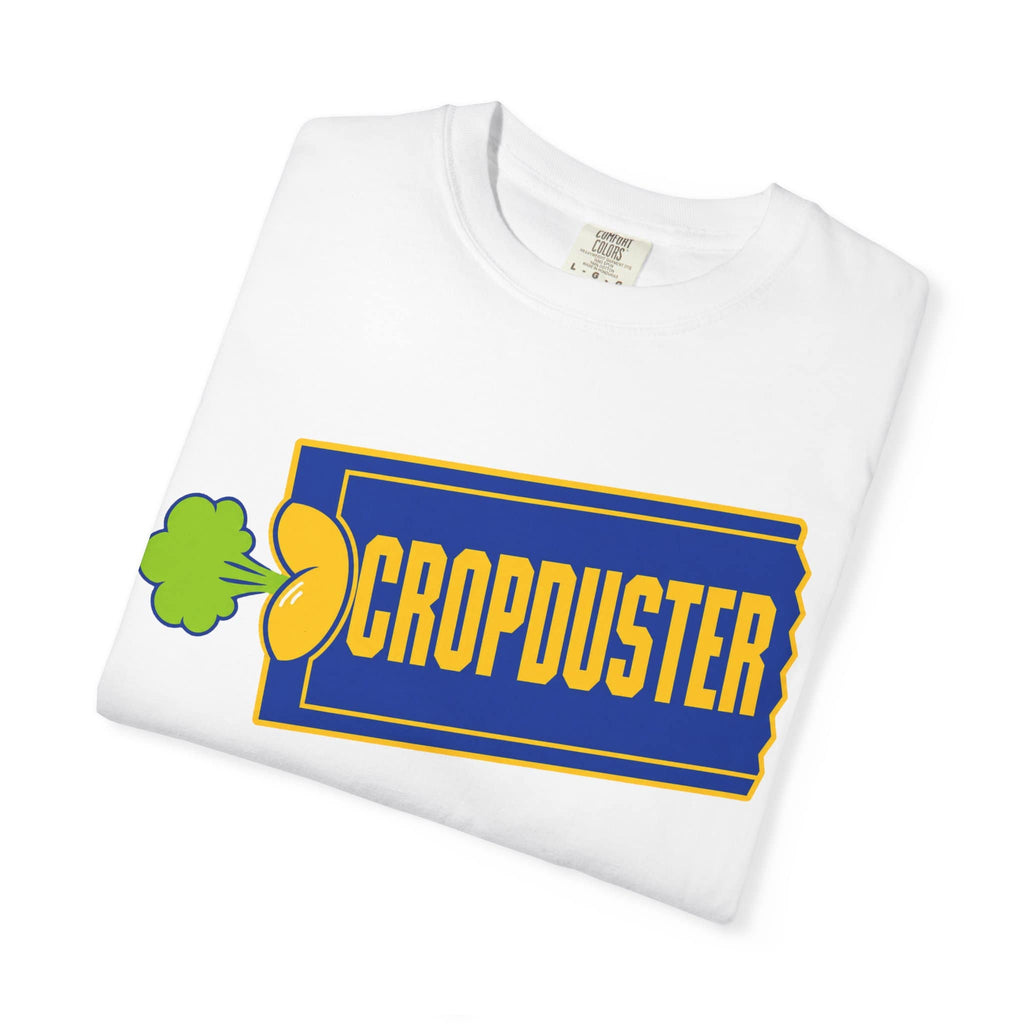 Crisp white folded cotton t-shirt displaying the colorful yellow, blue, and green nostalgic video store parody artwork.