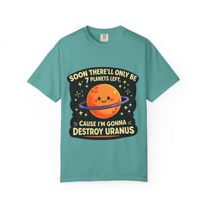 Flat lay of a teal short sleeve t-shirt with a cute planet and inappropriate space pun graphic on a white background.