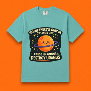 Flat lay of a teal Destroy Uranus funny meme t-shirt on a bright orange background.