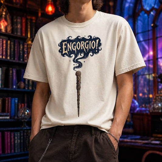 Engorgio magic wand graphic tee in cream, displayed front-facing against a contrasting dark blue background.