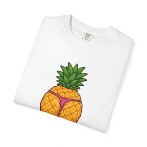 Flat lay of a folded white t-shirt showing a graphic print of a thick pineapple in a pink thong.
