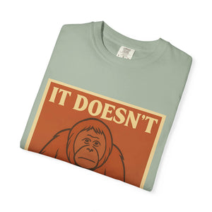 Folded green t-shirt featuring a retro poster of a sad orangutan with text 'It Doesn't Get Better