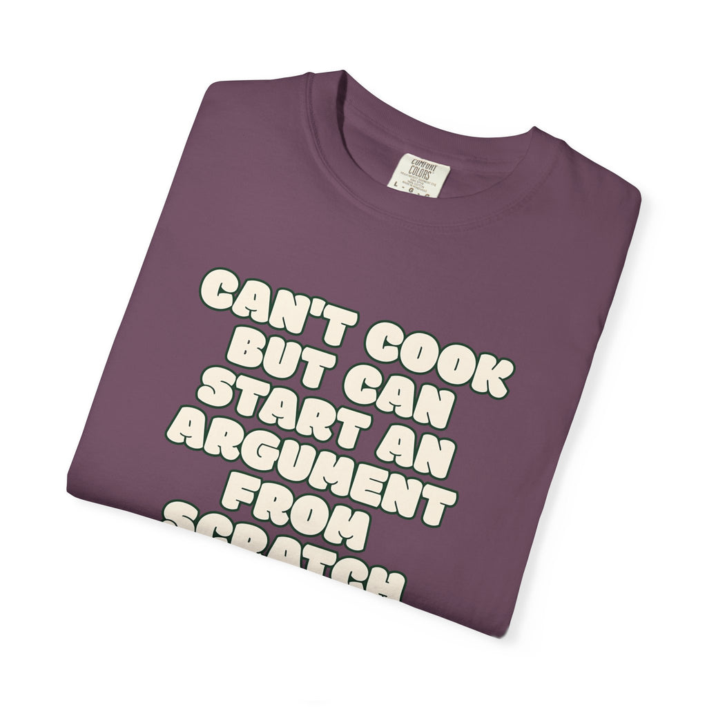 Folded purple t-shirt featuring Can’t Cook slogan.