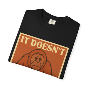 Folded black t-shirt featuring a retro poster of a sad orangutan with text 'It Doesn't Get Better