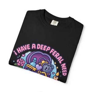 Folded black funny t-shirt contrasting with bright pastel trinket design