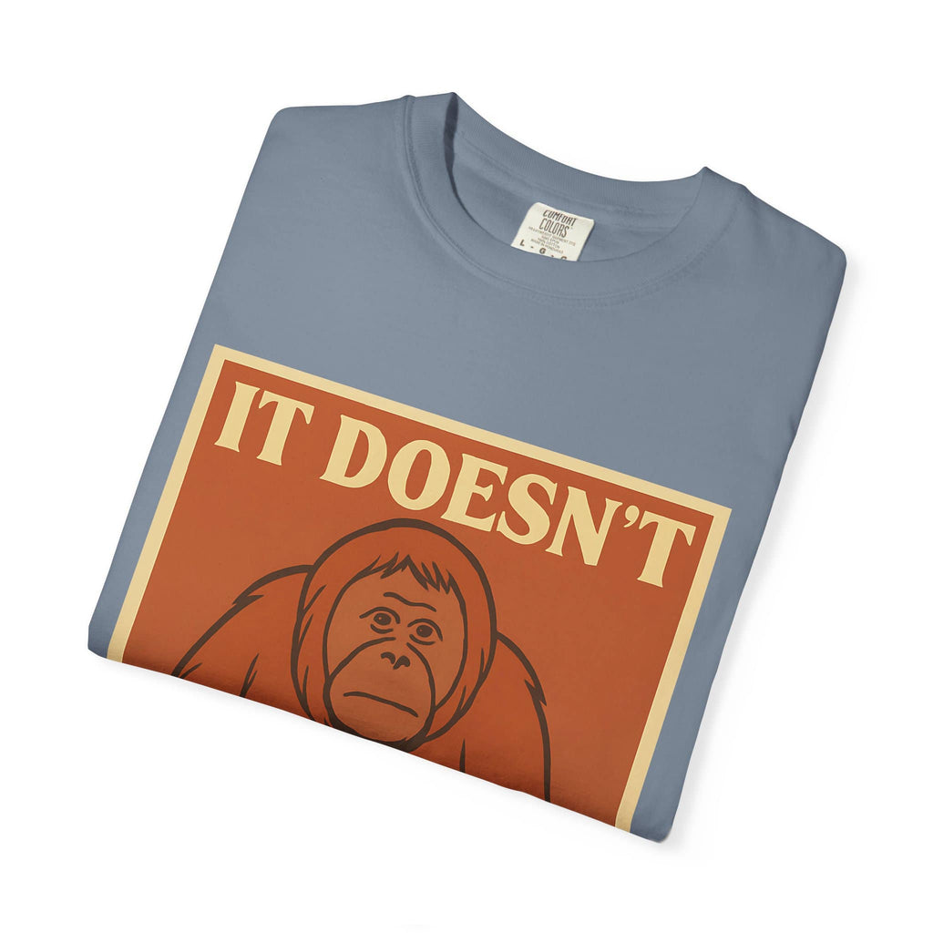 Folded blue t-shirt featuring a retro poster of a sad orangutan with text 'It Doesn't Get Better