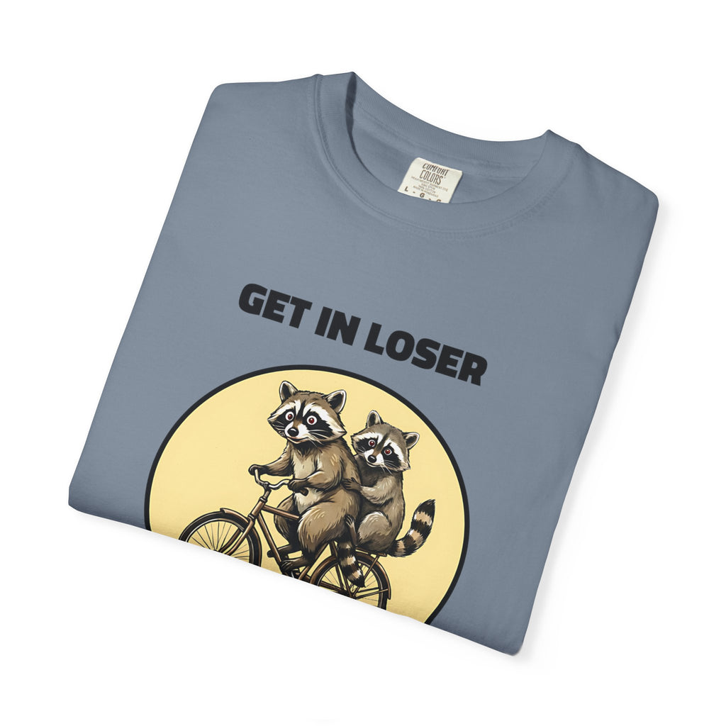 Folded blue jean t-shirt featuring Get In Loser We’re Getting Trashed meme design.