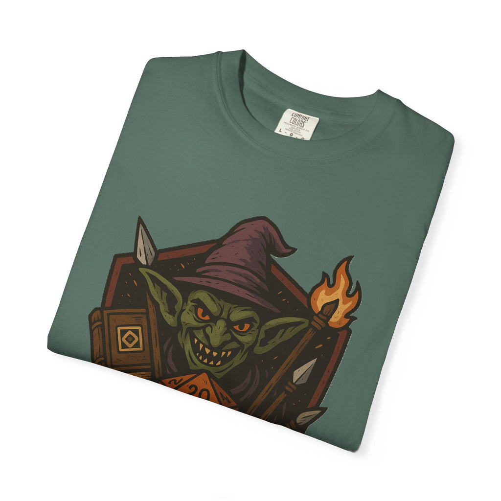 Folded spruce color t-shirt with No Goblemo graphic