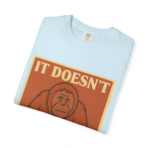 Folded light blue t-shirt featuring a retro poster of a sad orangutan with text 'It Doesn't Get Better