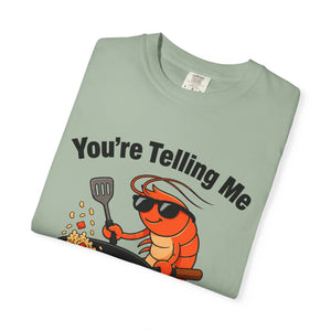 Folded green graphic t-shirt featuring shrimp fried rice design.