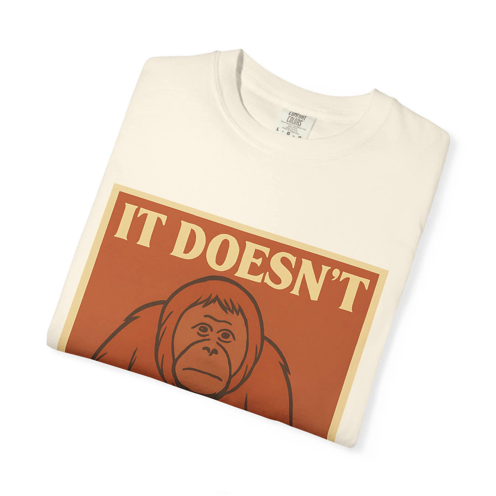 Folded cream colored t-shirt featuring a retro poster of a sad orangutan with text 'It Doesn't Get Better
