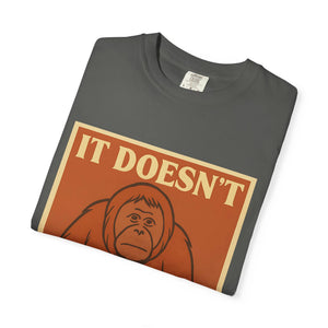 Folded dark grey t-shirt featuring a retro poster of a sad orangutan with text 'It Doesn't Get Better