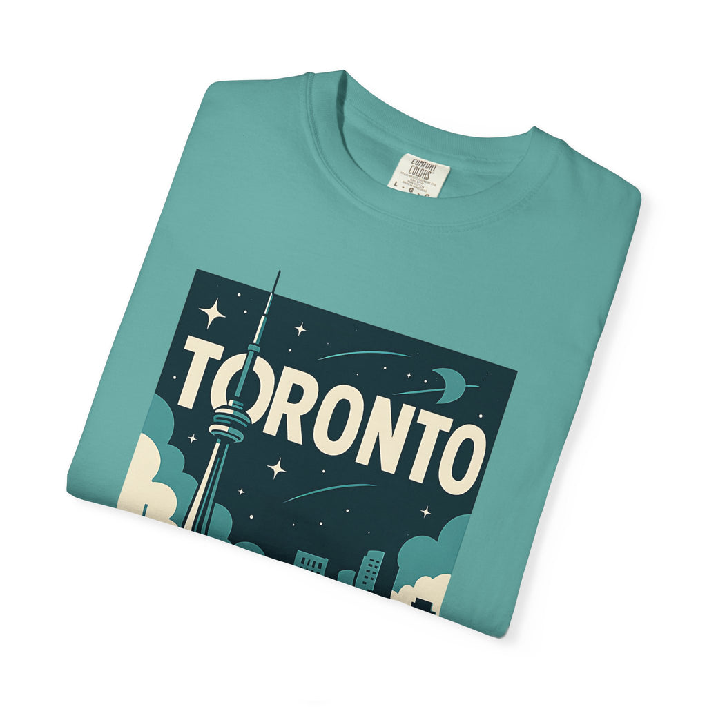 Folded teal t-shirt highlighting the Toronto typography and CN Tower illustration.
