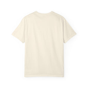 Back view of a plain ivory Comfort Colors 1717 blank t-shirt laid out flat against a neutral background