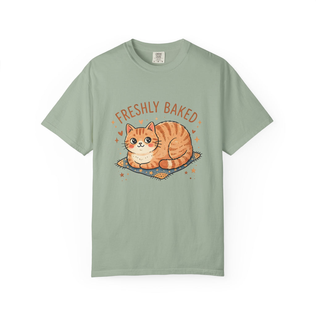 Flat-lay front view of a bay green Comfort Colors 1717 t-shirt featuring the Freshly Baked orange tabby cat graphic.