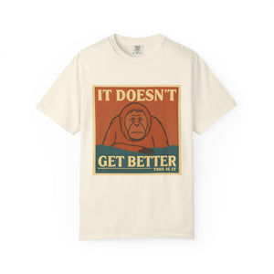 Cream colored t-shirt featuring a retro poster of a sad orangutan with text 'It Doesn't Get Better