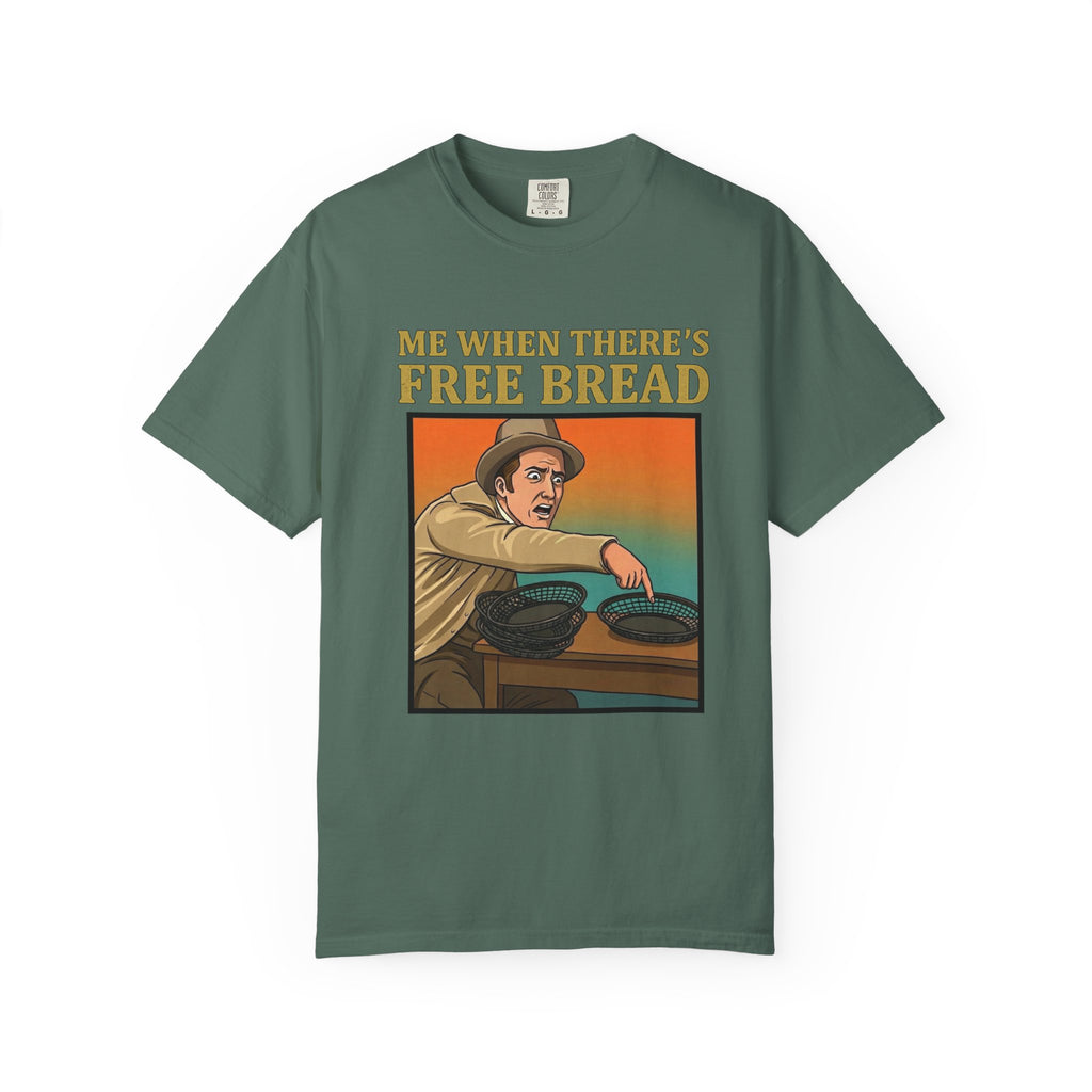 Flat lay of blue spruce graphic t-shirt on white background featuring Me When There’s Free Bread design.