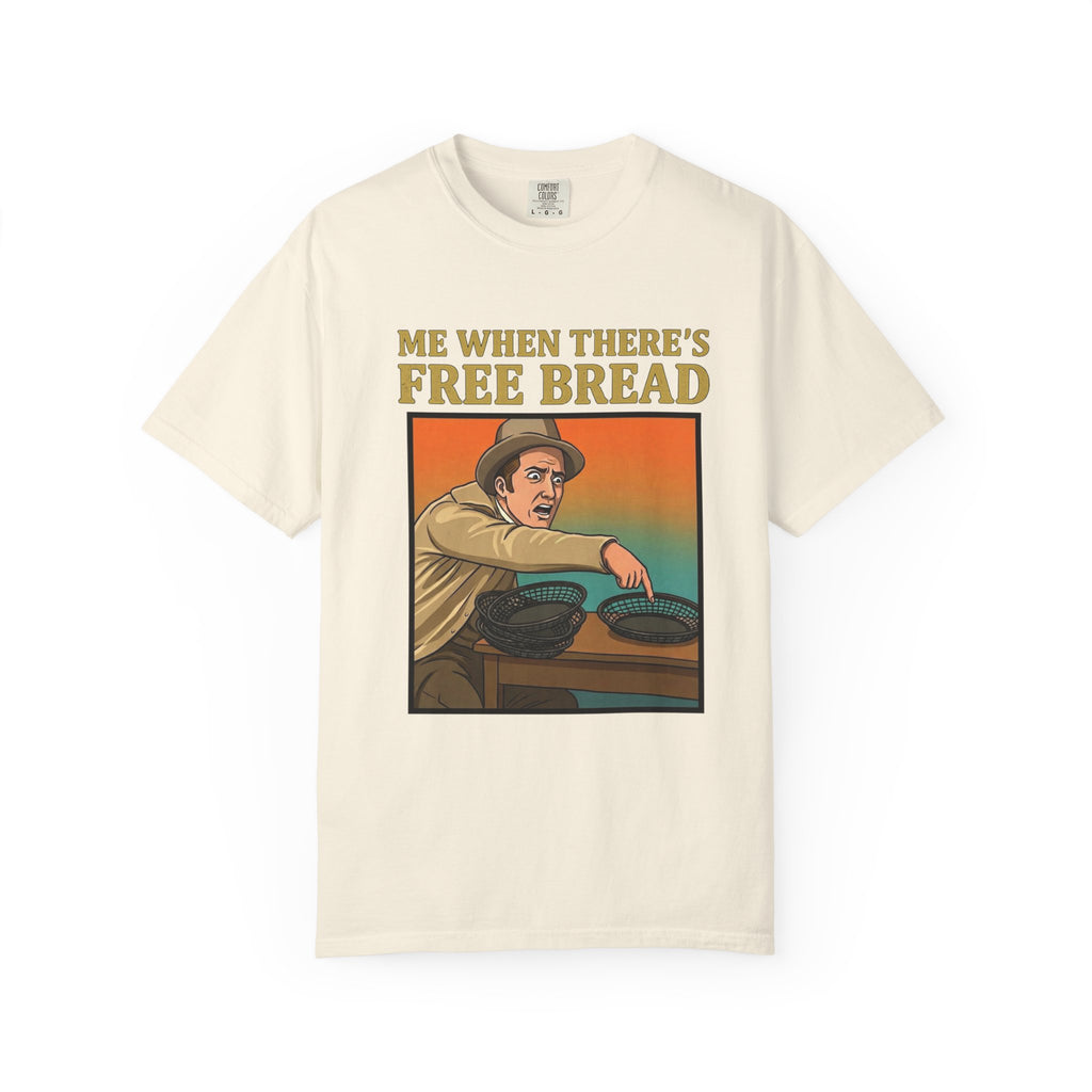 Flat lay of ivory graphic t-shirt on white background featuring Me When There’s Free Bread design.