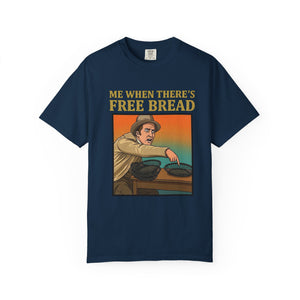 Flat lay of true navy graphic t-shirt on white background featuring Me When There’s Free Bread design.