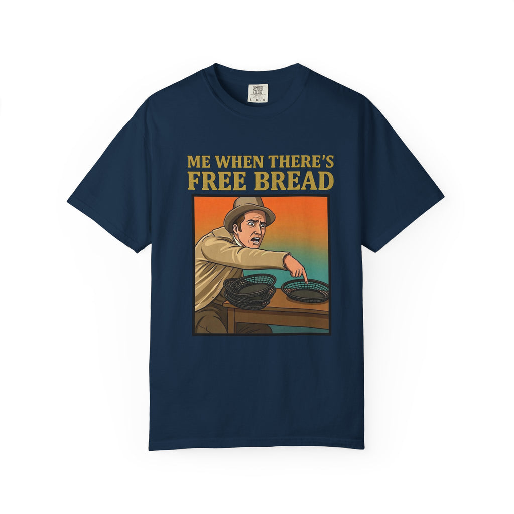 Flat lay of true navy graphic t-shirt on white background featuring Me When There’s Free Bread design.