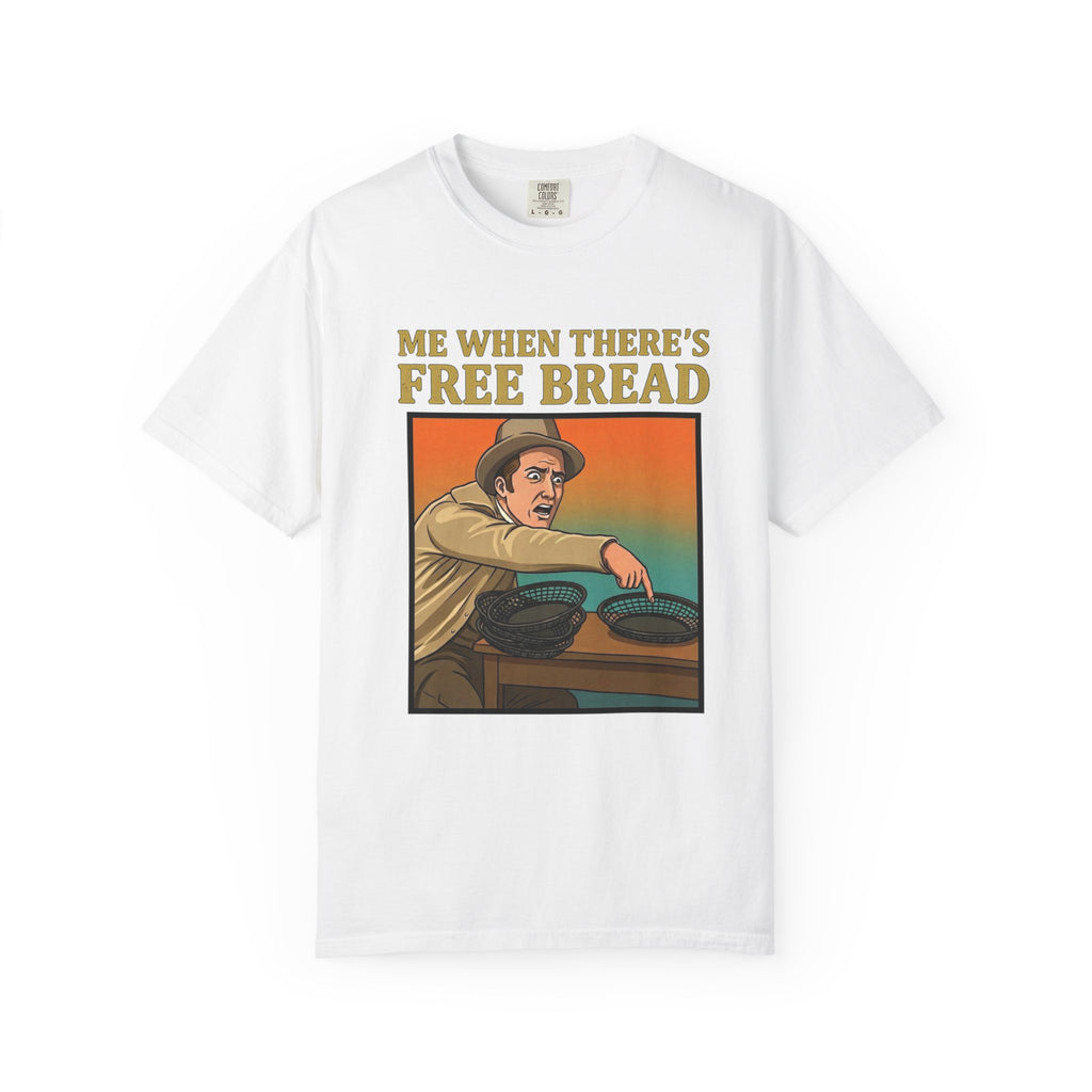 Flat lay of white graphic t-shirt on white background featuring Me When There’s Free Bread design.