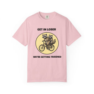 Flat lay of blossom graphic t-shirt on white background featuring Get In Loser We’re Getting Trashed meme design.