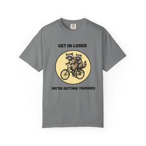 Flat lay of grey graphic t-shirt on white background featuring Get In Loser We’re Getting Trashed meme design.