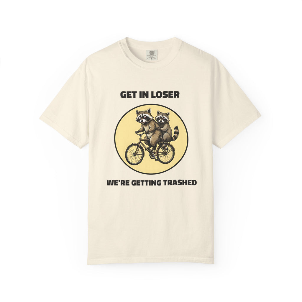 Flat lay of ivory graphic t-shirt on white background featuring Get In Loser We’re Getting Trashed meme design.