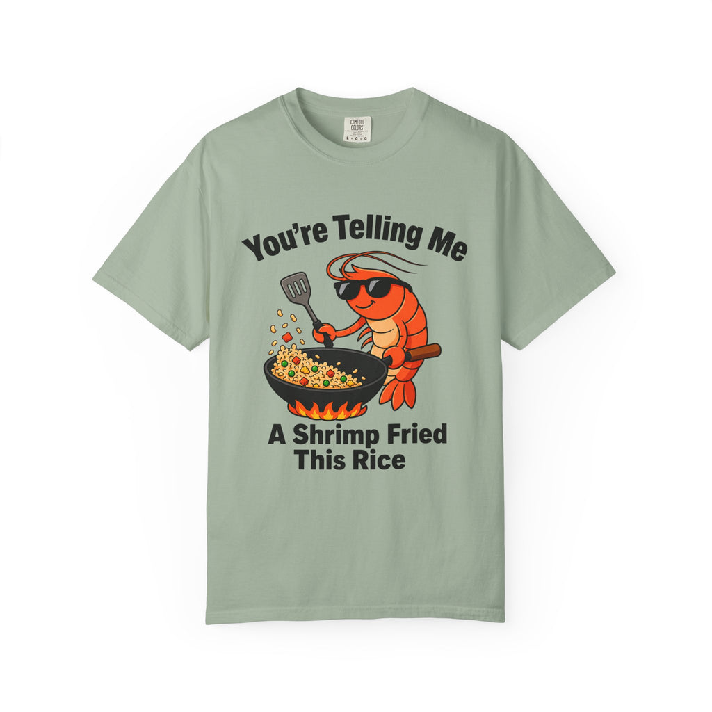 Flat lay of green graphic t-shirt on white background featuring shrimp fried rice design. 