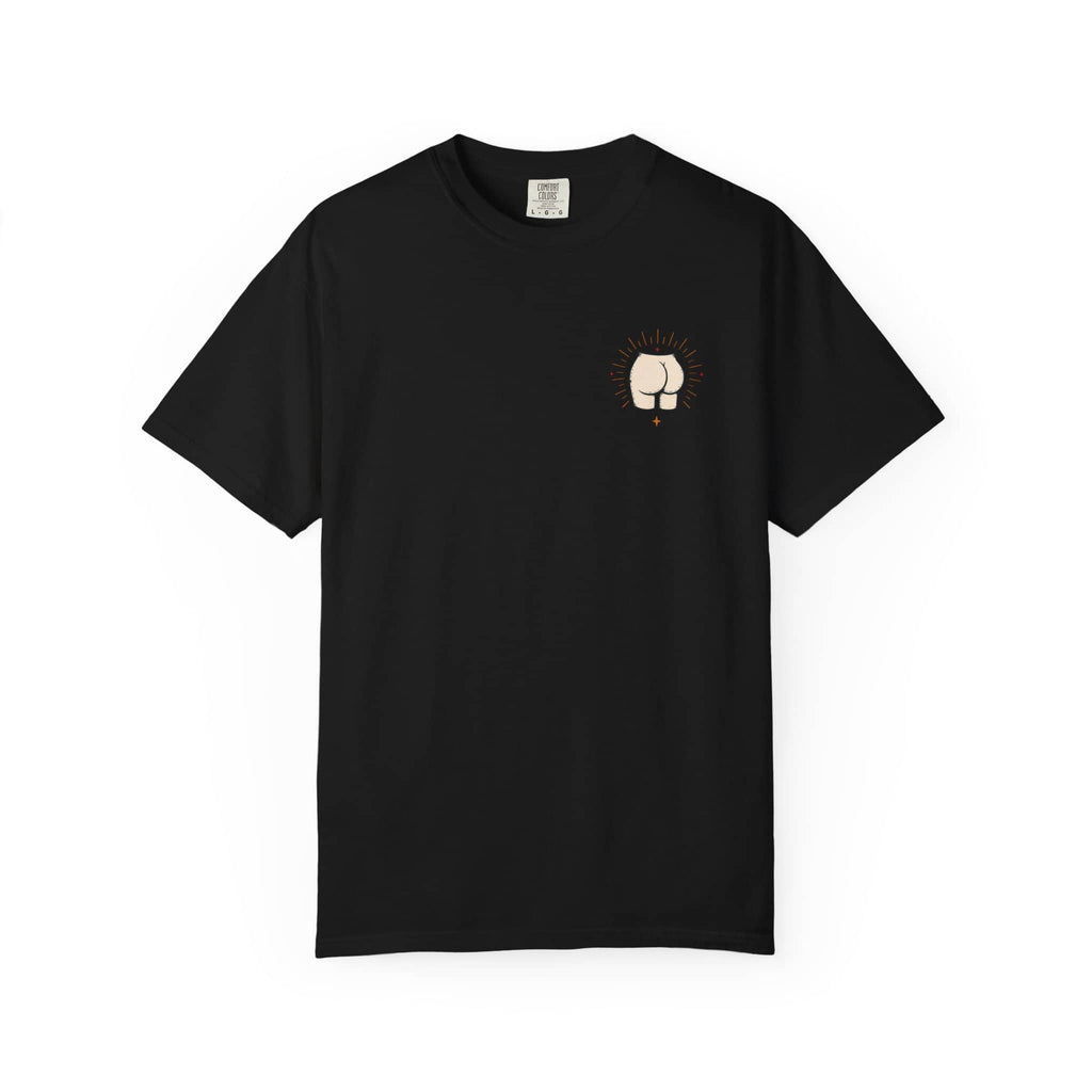Flat lay of the front of a black t-shirt featuring a small minimalist drawing of a butt with radiating lines on the left chest.