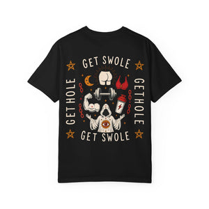Flat lay of the back of a black t-shirt featuring a chaotic occult graphic with the text Get Swole, Get Hole, a cultist, a protein shaker, and a barbell.