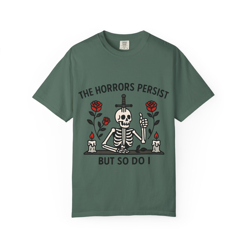 Flat lay of a moss green graphic tee featuring traditional tattoo style skeleton art.