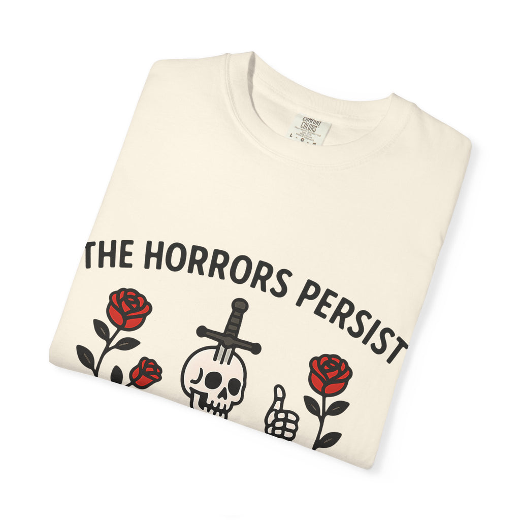 Folded ivory Comfort Colors t-shirt featuring a skeleton with a sword in its head giving a thumbs up.