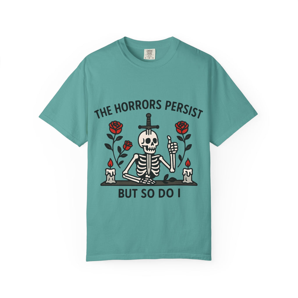 Folded teal blue t-shirt with black text "The Horrors Persist".