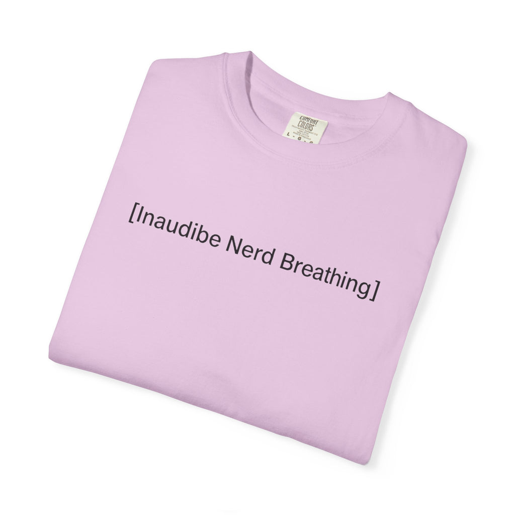 A folded lavender-colored T-shirt featuring the minimalist [Inaudible Nerd Breathing] graphic
