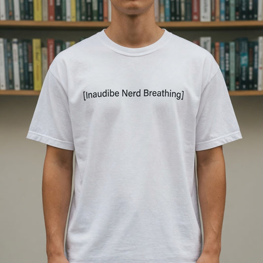 A flat-lay view of a white T-shirt with the [Inaudible Nerd Breathing] graphic, set against a dark blue to grey gradient background