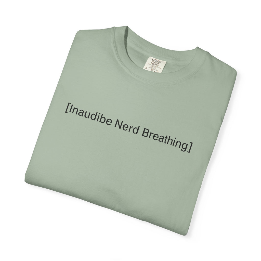 Folded sage green T-shirt with the text [Inaudible Nerd Breathing] printed in the center