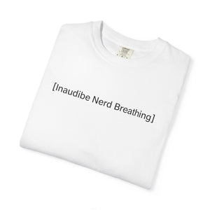 Folded white T-shirt with the text [Inaudible Nerd Breathing] printed in the center