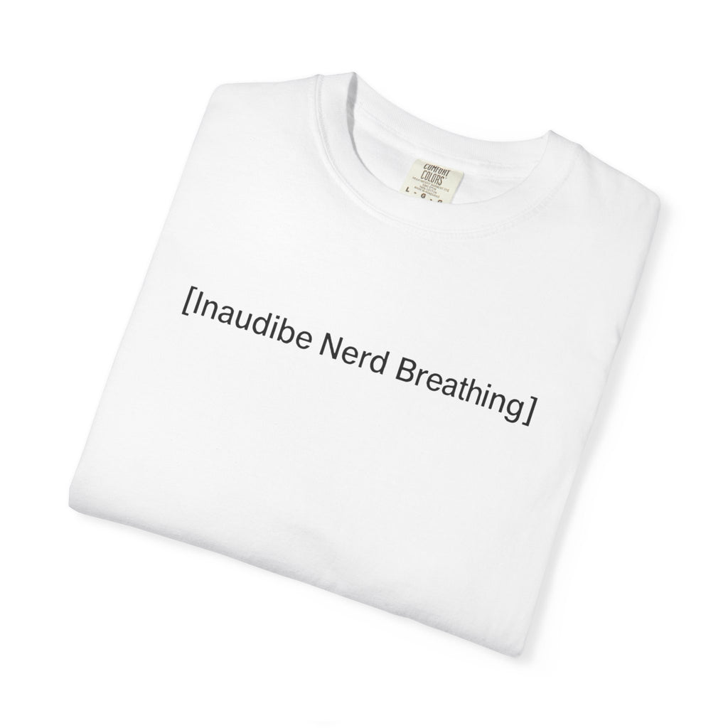 Folded white T-shirt with the text [Inaudible Nerd Breathing] printed in the center